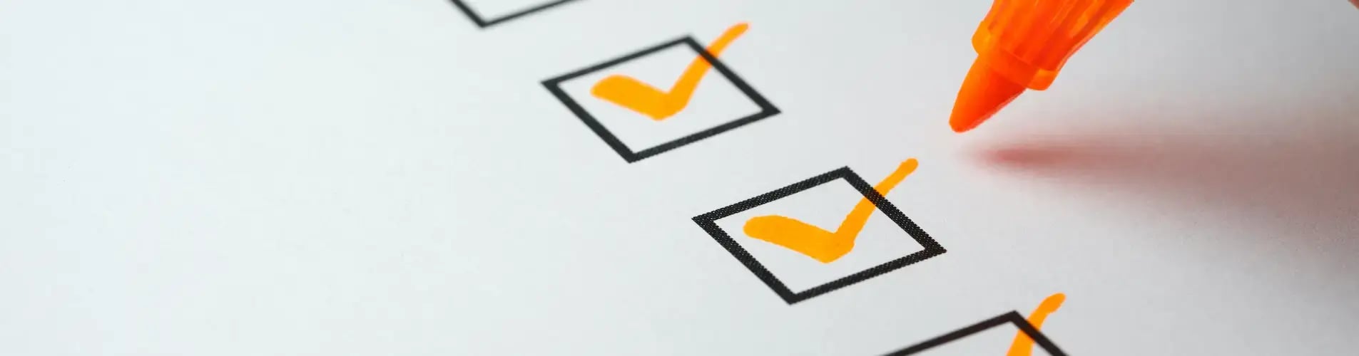 Orange checkmarks on checklist