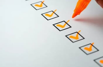 Orange checkmarks on checklist