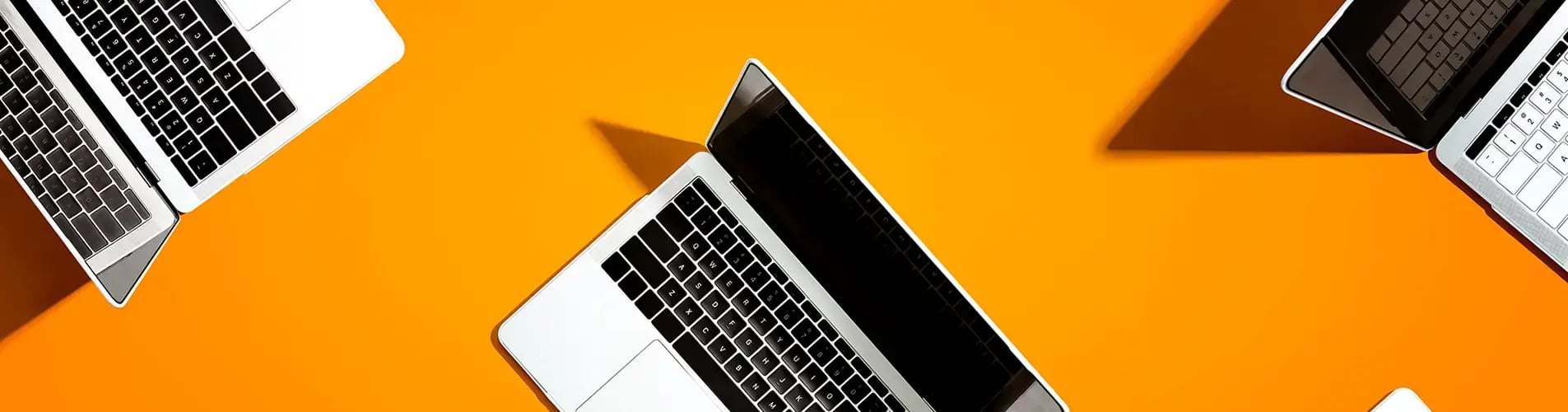 Laptop on orange background 
