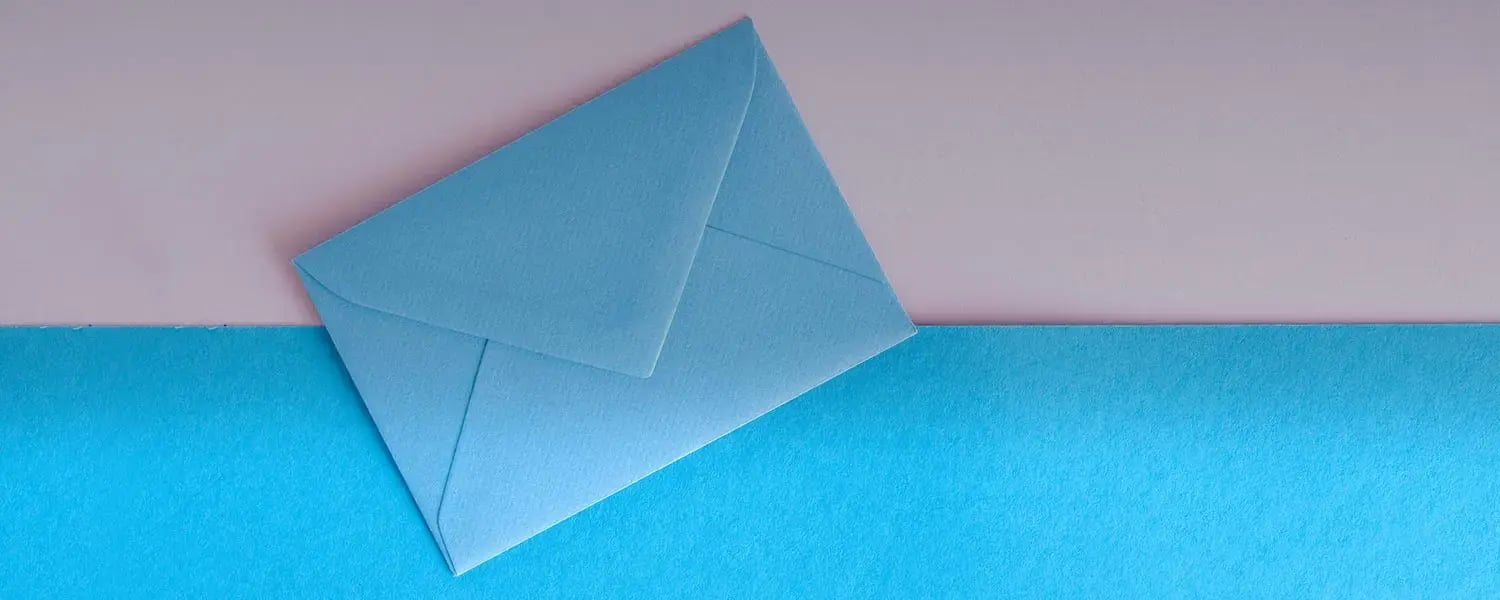 Blue envelope on blue and pink paper
